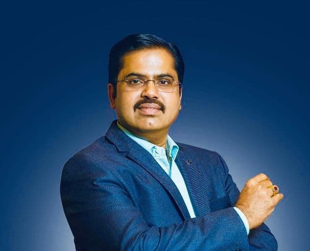 Hariharan Ramachandran wearing a blue suit